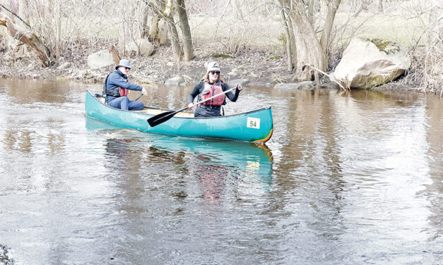 Bright skies and record numbers mark 52nd Raisin River Canoe Race