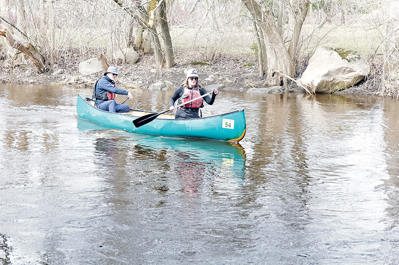 Bright skies and record numbers mark 52nd Raisin River Canoe Race